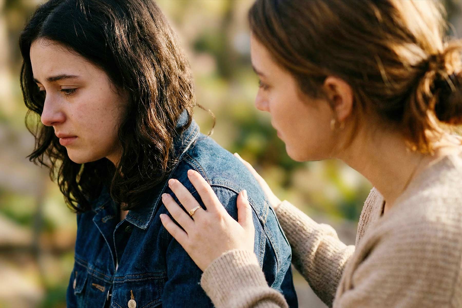 Two women supporting each other through a difficult time.